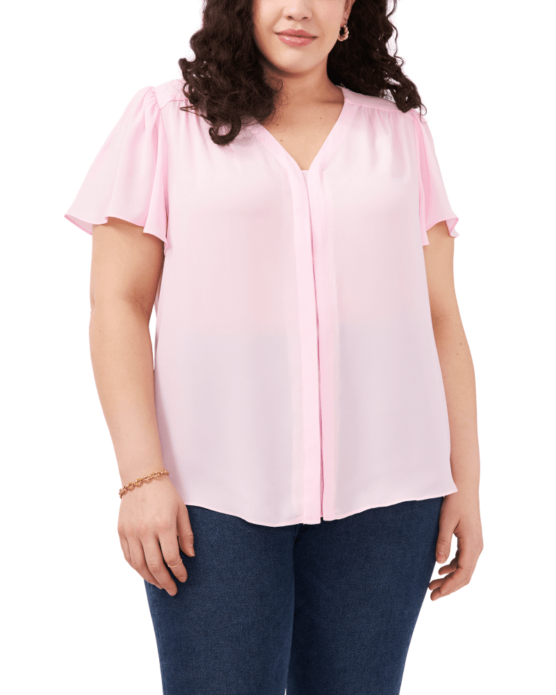 Front of a model wearing a size 1X Lily Flutter Sleeve Blouse in PINK HORIZON by Vince Camuto. | dia_product_style_image_id:261167